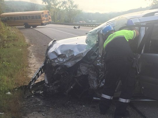 School bus blows tire, collides with SUV