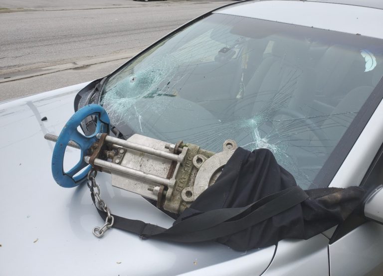 A water valve through a windshield has police asking questions