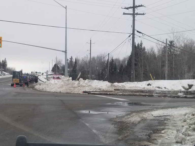 OPP charges driver for insecure load of hydro poles