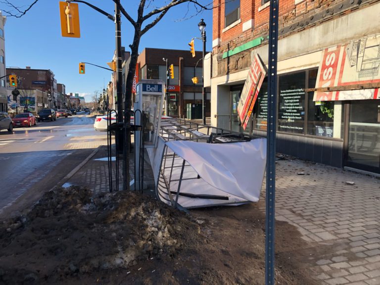 Fallen awning closes downtown sidewalk