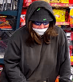 Police say gas station robbed by woman with a gun