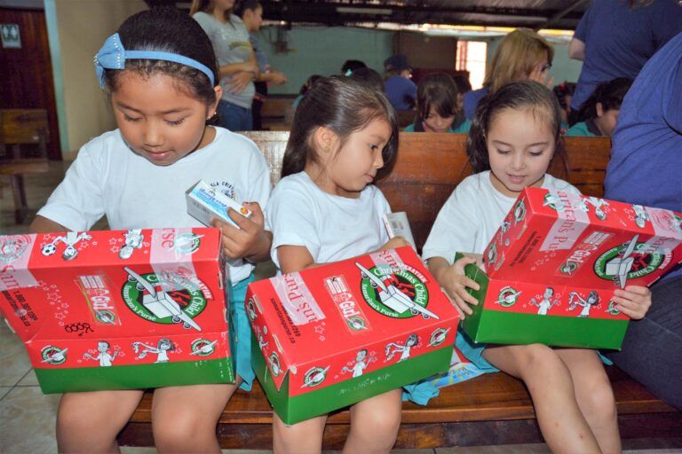 Local residents pack more than 2,100 shoeboxes for children in need