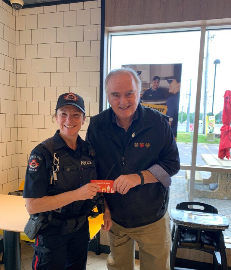 Bike patrol officers rewarding kids with McDonald’s coupons