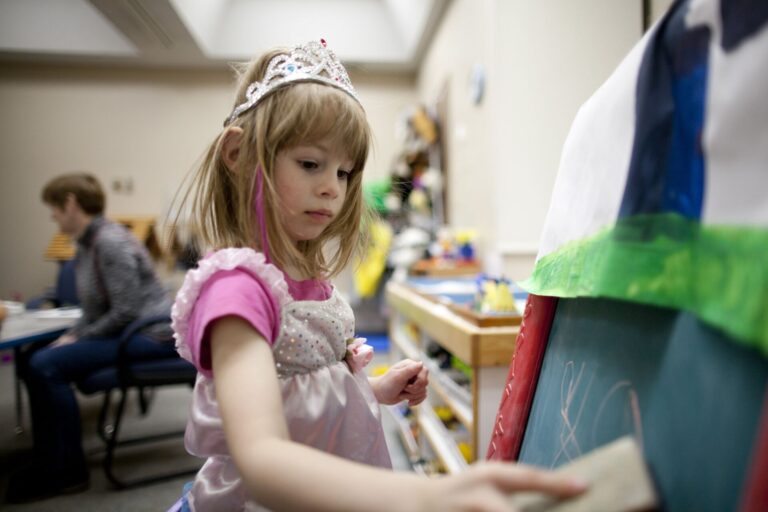 Hands celebrating World Autism Day locally