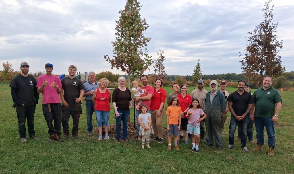 Community tree planting at St. Gregory Catholic School in Powassan